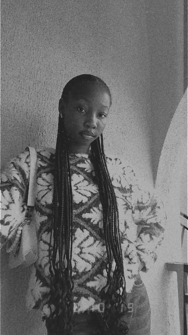 Abby in black and white with long braids